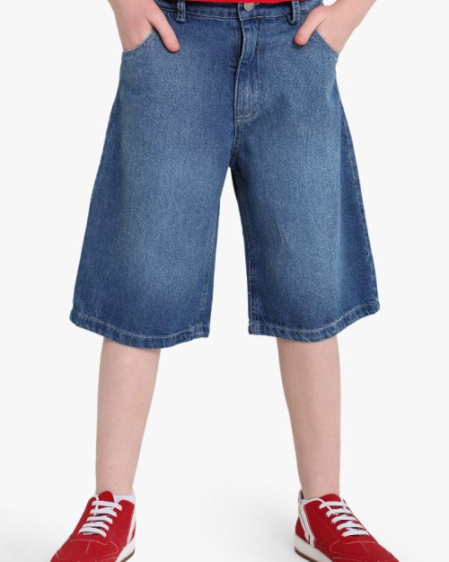 Girls baggy wide-leg denim shorts in medium blue wash with five-pocket design 4 yrs Front | Locafy