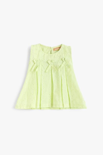 Baby girl pleated broderie anglaise top in soft lime green with bow detail 3-6 mth Front | Locafy